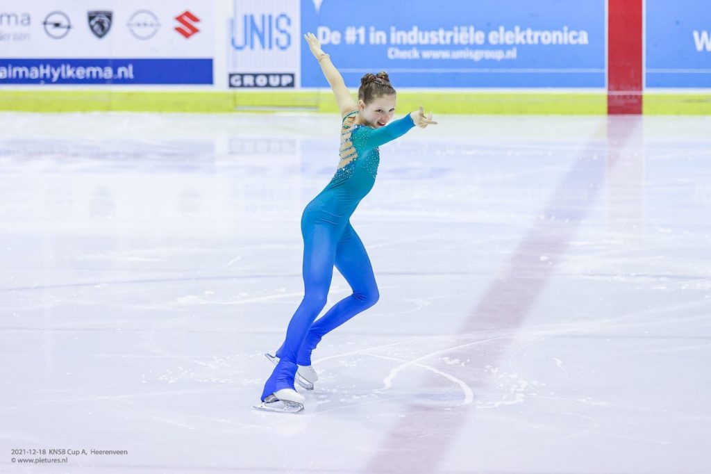 Young girl giving an ice skating performance